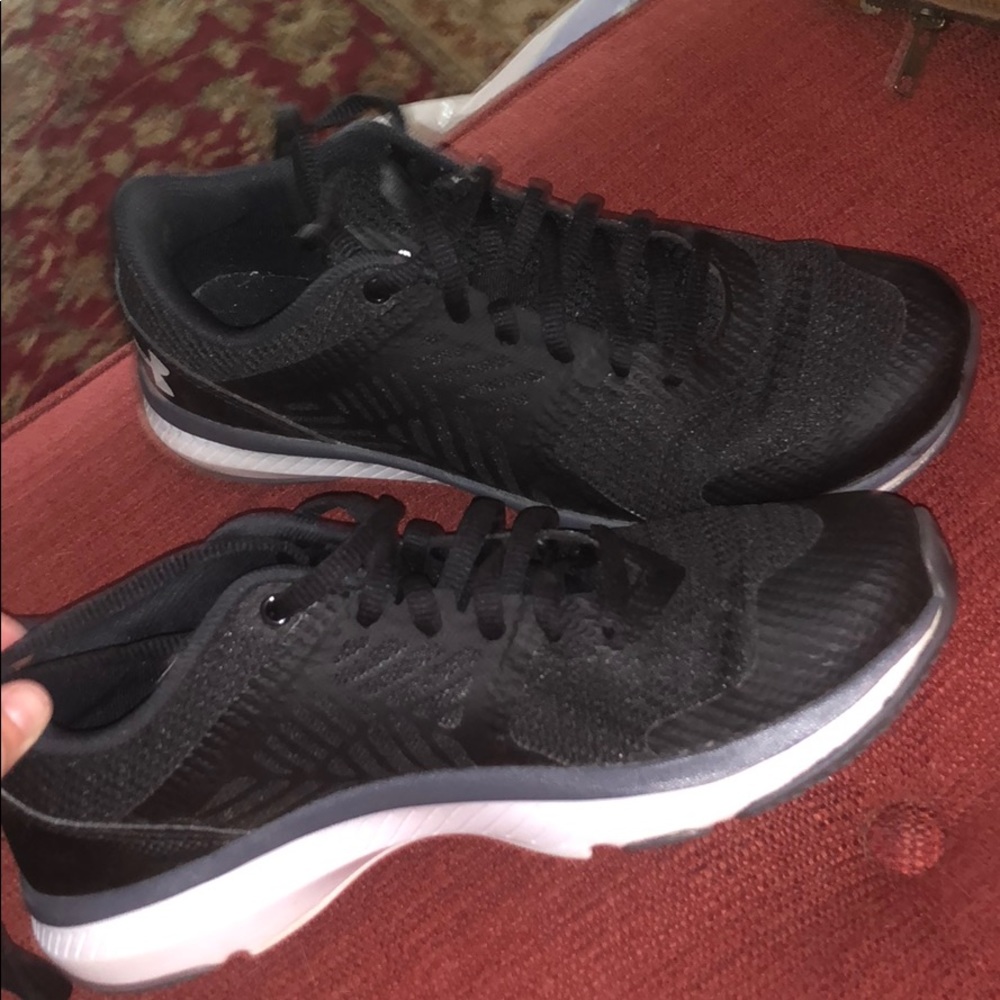 Under Armor tennis shoes.